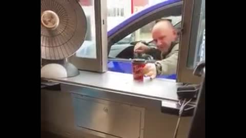 Man Sanitizes His Coffee At Drive-Thru