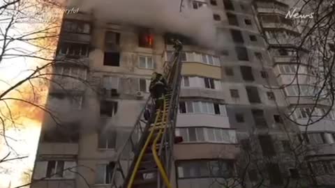 Kyiv fire crews tackle blaze in apartment block after the Russian strike