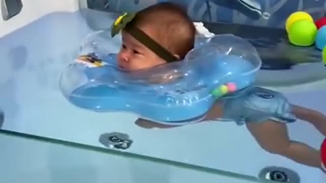 Baby pool syming baby