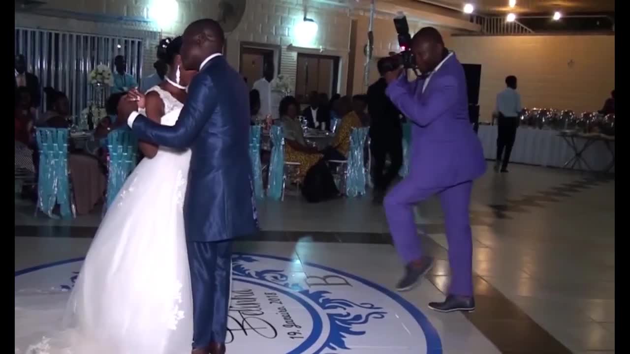 Funny Photographer Outshines Wedding Couple on Dancefloor