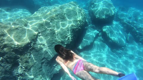 Woman Swimming Underwater