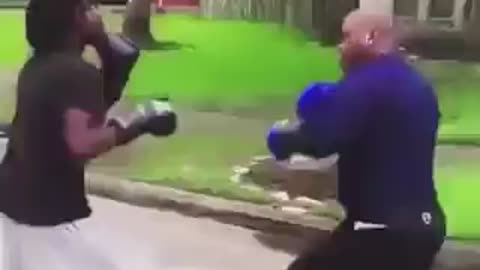 Father Disciplines Son With Boxing