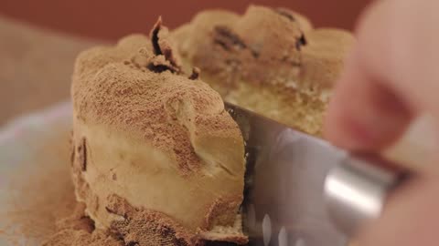 Cutting a little chocolate cake