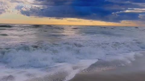 "Ocean Waves and Cloudy Skies"