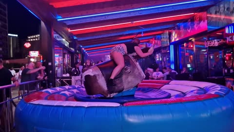 😱 OMG! Pretty Girl Fails at Mechanical Bull Ride in Benidorm | Spain 2024