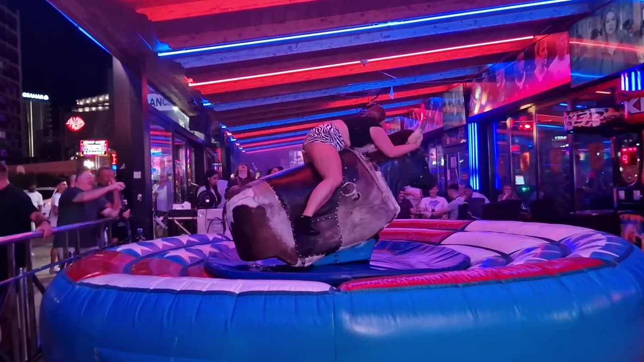 😱 OMG! Pretty Girl Fails at Mechanical Bull Ride in Benidorm | Spain 2024