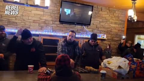 Freedom Convoy: truckers pray at Boutts border as police deployed