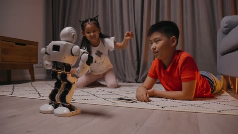 Cute babies play with Cute Robot.