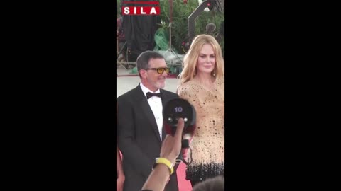 Antonio Banderas stuns in black tux at Venice premiere with partner