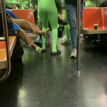 Gang of women in neon green bodysuits attack passengers on NYC subway
