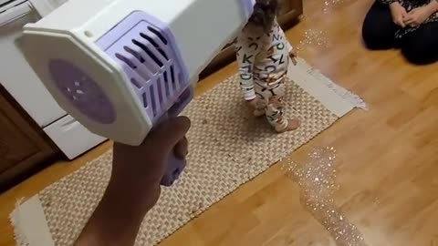 Bubble machine blowing children