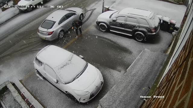 Guy Slips Twice on Icy Ground While Walking From Car to Doorstep