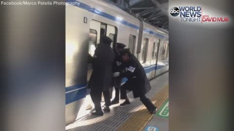 Professional Pushers Shove Passengers Onto Busy Tokyo Train
