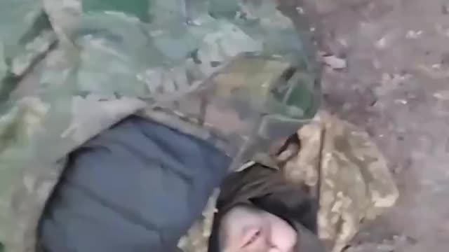 Russian medics treat Ukrainian POW's that were wounded by mortar fire