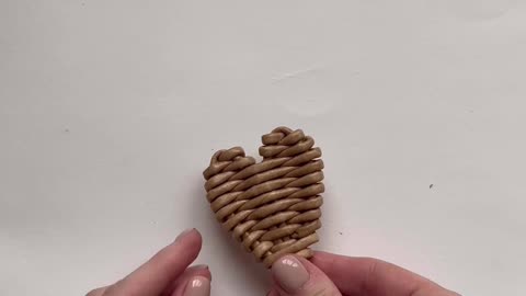 The process of making a woven heart.