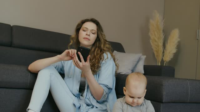 Kid playing with mother