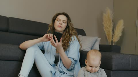 Kid playing with mother