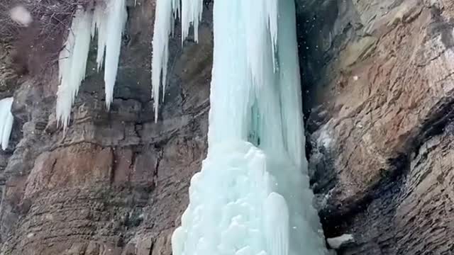 Climbing up a giant frozen waterfall...