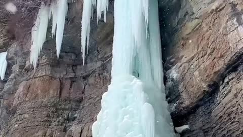 Climbing up a giant frozen waterfall...