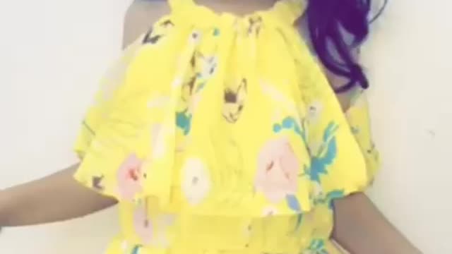 This little girl is dancing happily in front of her father