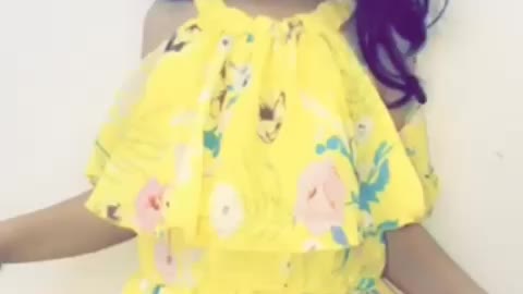 This little girl is dancing happily in front of her father