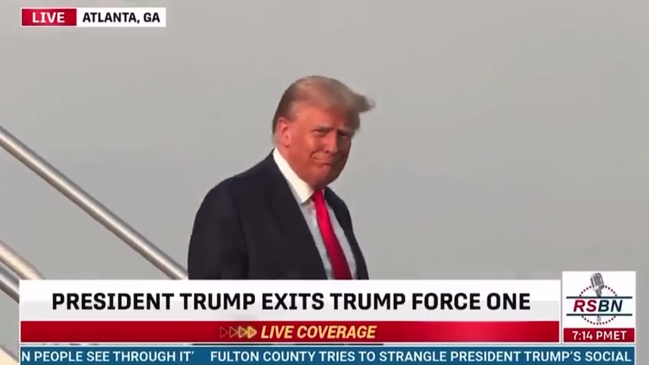 BREAKING: Donald Trump gives a smile and a thumbs up as he deplanes in Atlanta