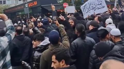 Anti-Israel protest in Hamburg, Germany. Takuban flags in the crowd