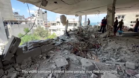 Gazan searches for his family's remains after Israeli airstrike