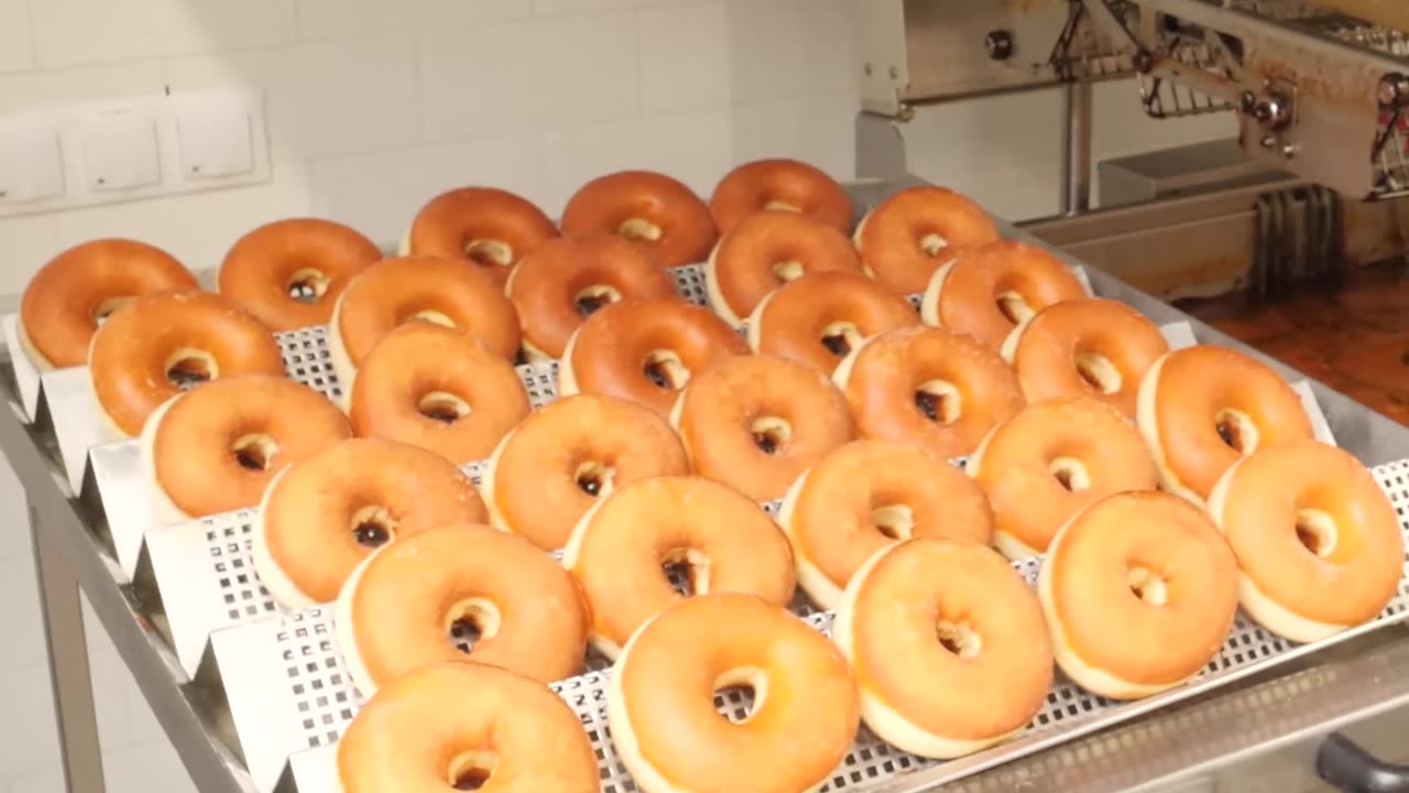 Who makes holes in the donuts?