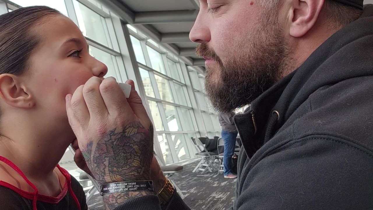 Dad Expertly Applies Daughter's Lipstick for Cheer Competition