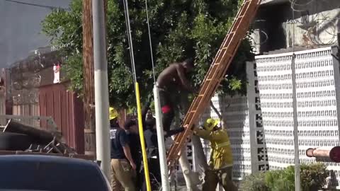 Suspect Jumps Roof To Roof, Crowd Fights with LAPD