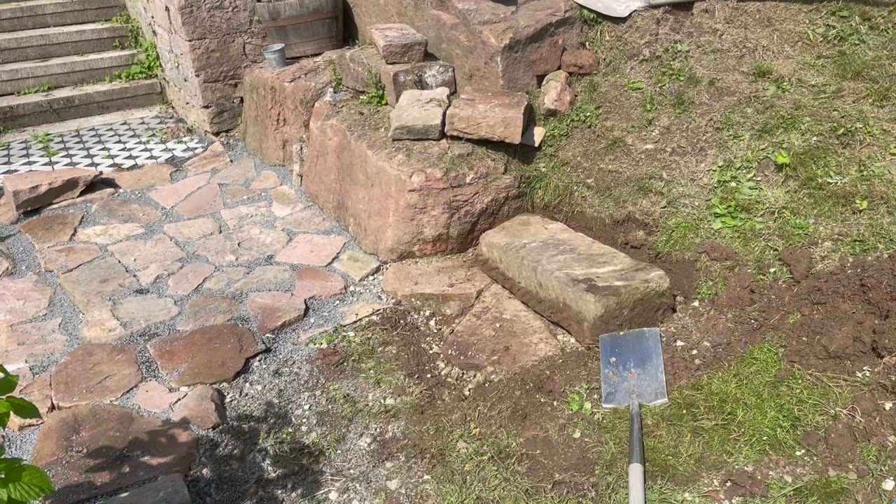 Stone walkway around the pond