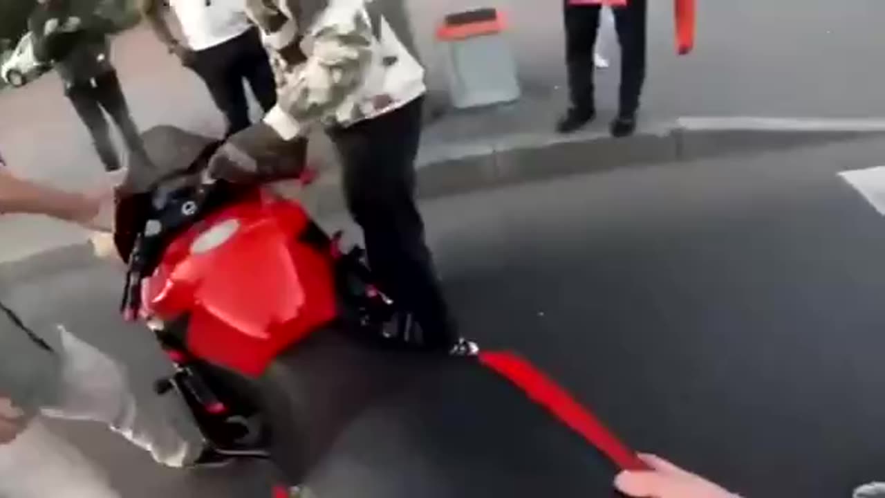 Russia. Road accident and road rage of a motorcyclist and pedestrians.