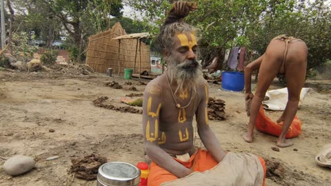 A saint doing penance sitting in the middle of a fire in Haridwar, India