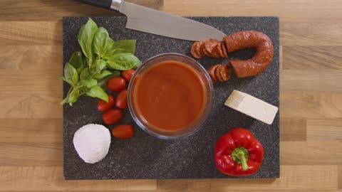 Top View Male Placing Bowl of Sauce on Worktop