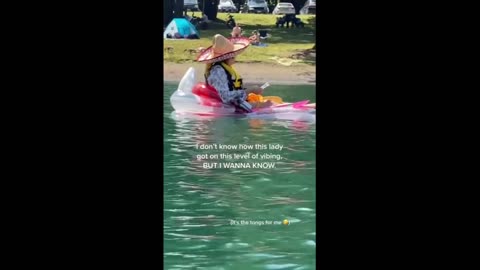 Lady is living her best life paddling & eating at the lake