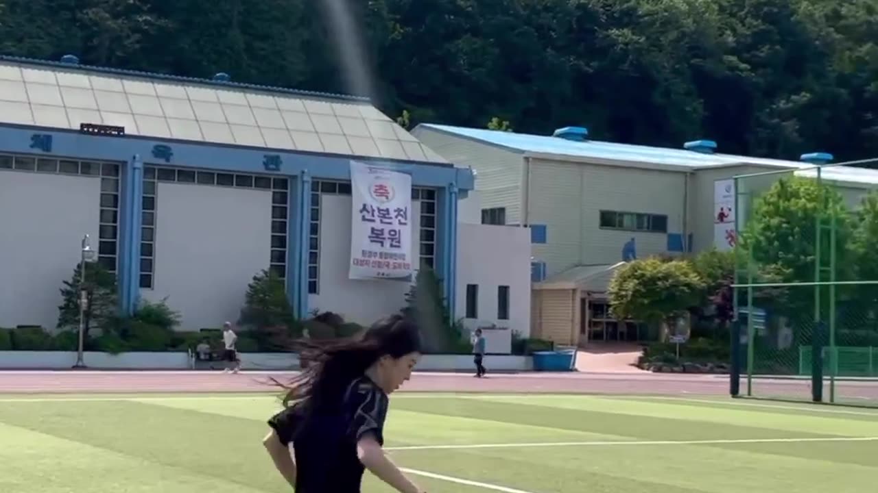 Beauty Playing Soccer on a Sunny day