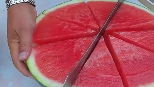 Cut up a watermelon and eat it