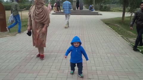 Very little boy trying to walk