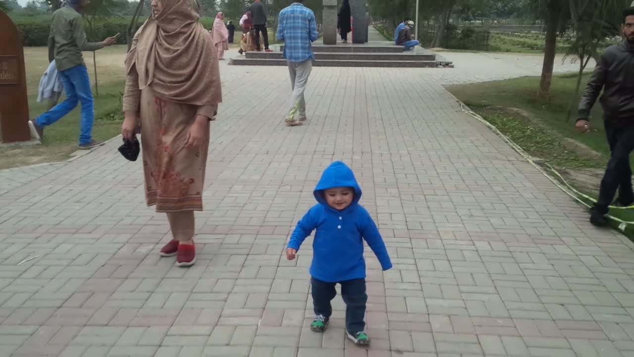 Very little boy trying to walk