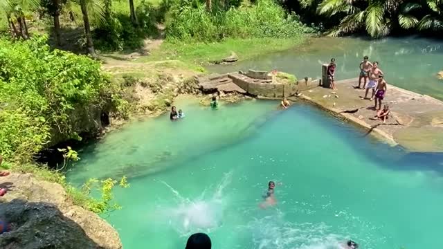 Kids Jump Into Natural Spring