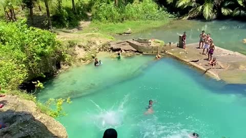 Kids Jump Into Natural Spring