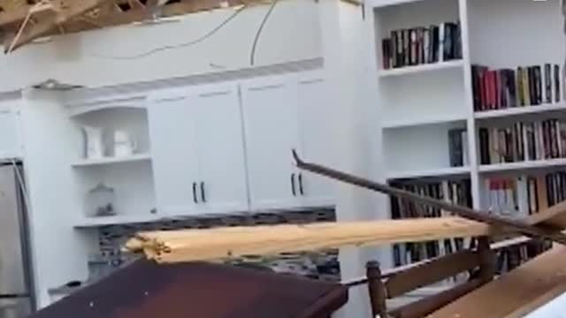 Kentucky man plays in home destroyed by