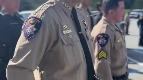 Saluting the 'Pride' flag while in uniform..