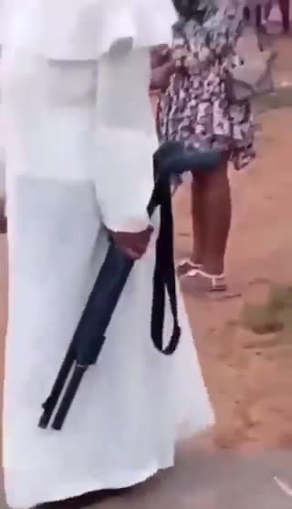 A Nigerian Catholic priest carries a shotgun because 200+ Christians were murdered.