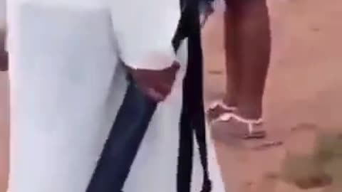 A Nigerian Catholic priest carries a shotgun because 200+ Christians were murdered.