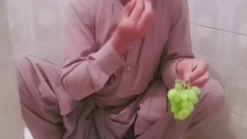 Eating grapes in washroom