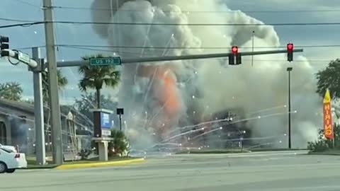 A fireworks store in Florida erupted into flames after an SUV crashed into it