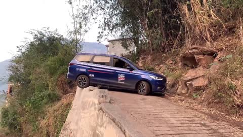 The driving expert demonstrates the very narrow road U-turn skills