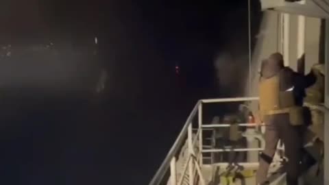 Soldiers on a Russian battleship destroy suicide boats, one of which harm their ship